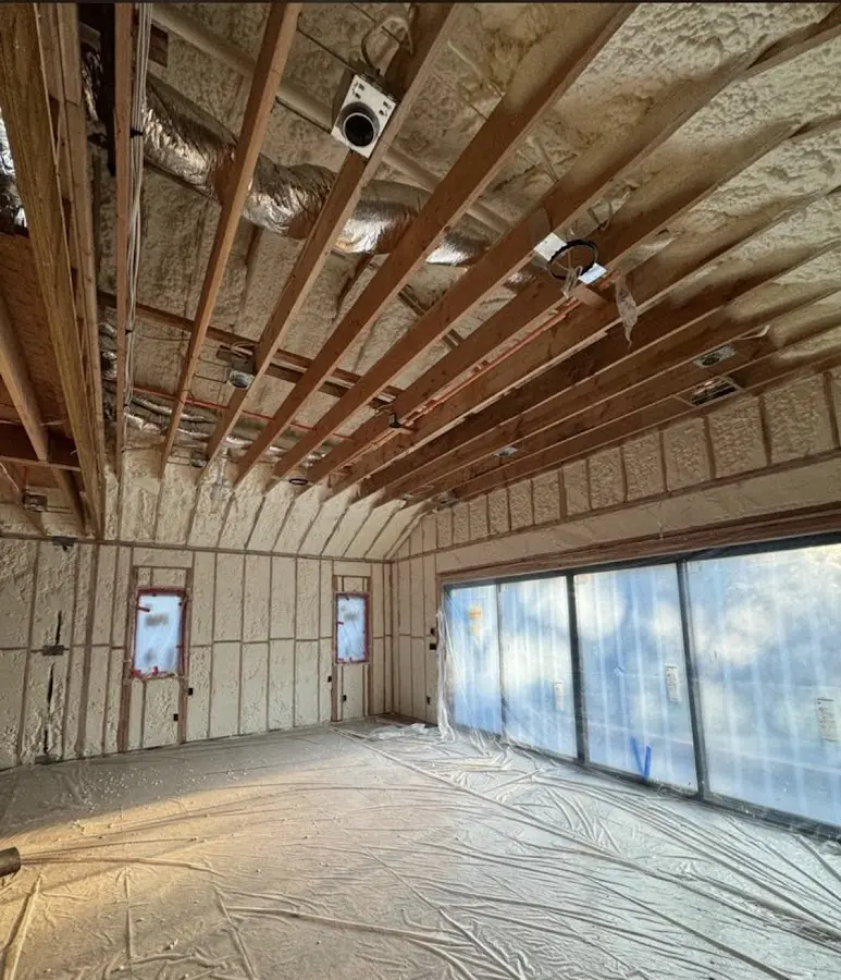 Interior walls and ceiling insulated with spray foam during new construction in North Haven